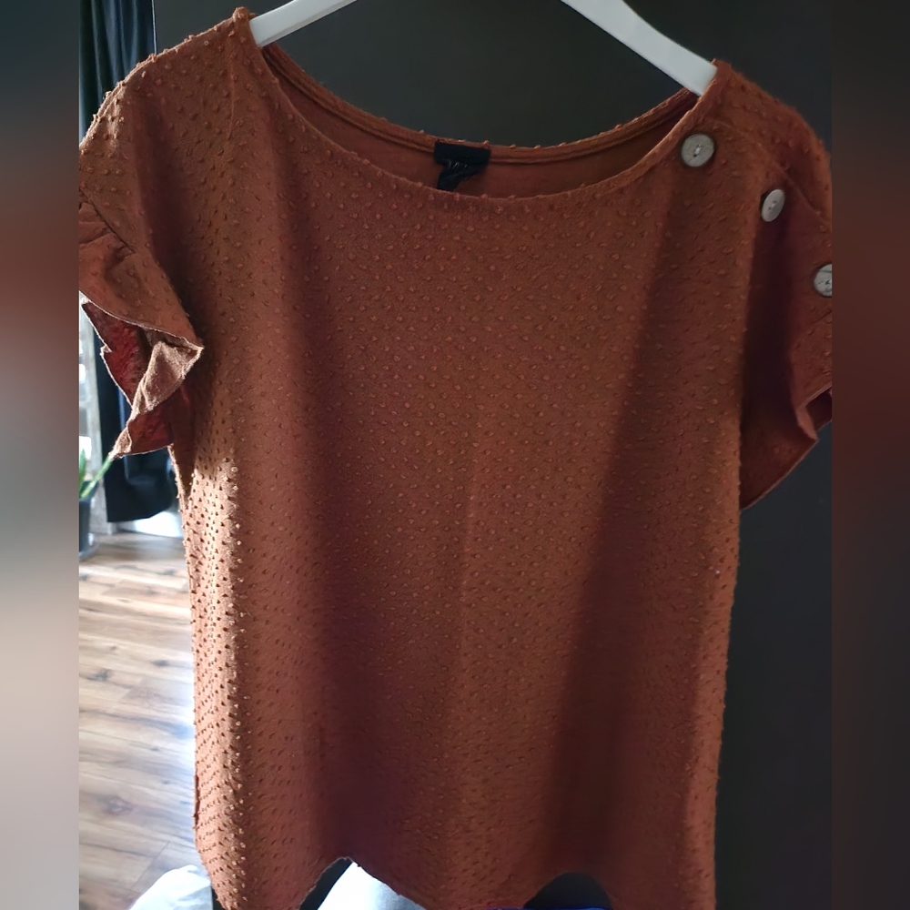 Pumpkin colored top